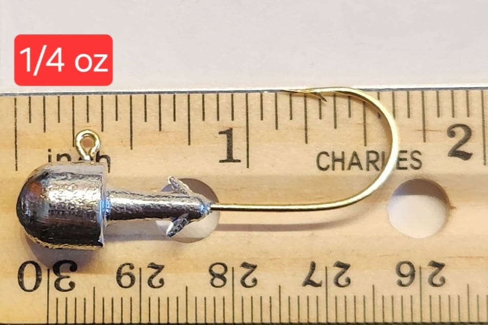 A fishing hook is shown on the ruler.