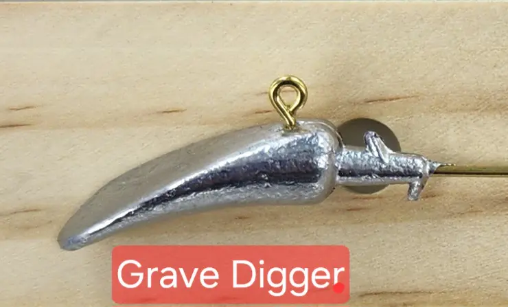 A metal object with the words grave digger underneath it.