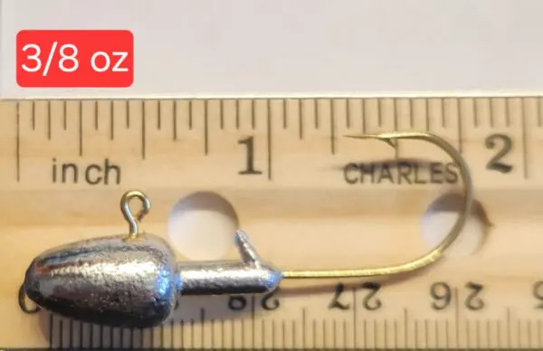 A fishing hook is shown on the ruler.