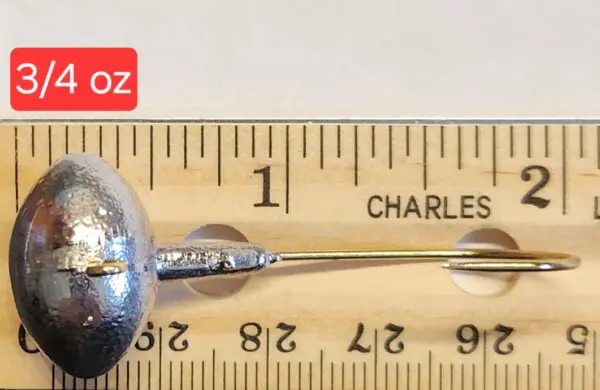 A close up of a measuring tape with a metal object