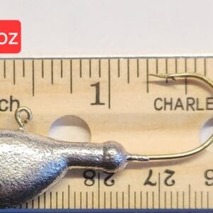 A fishing hook is shown next to a ruler.