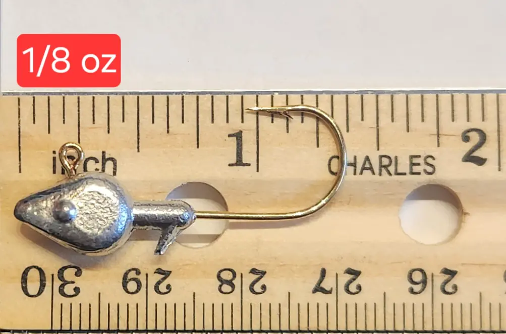 A wooden ruler with a metal hook and a measuring tape.