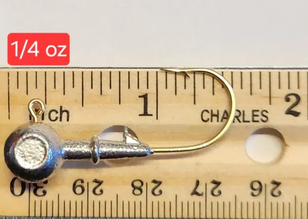 A fishing hook is shown on the ruler.