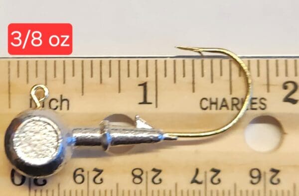 A fishing hook is shown on the scale.