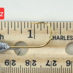 A fishing hook is shown on the side of a ruler.