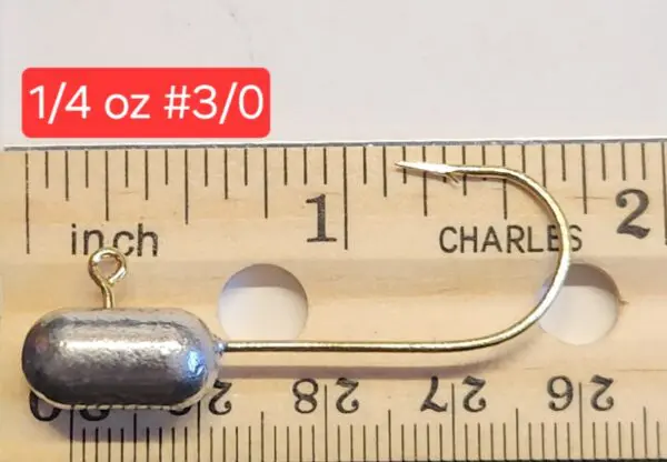 A fishing hook is shown on the ruler.