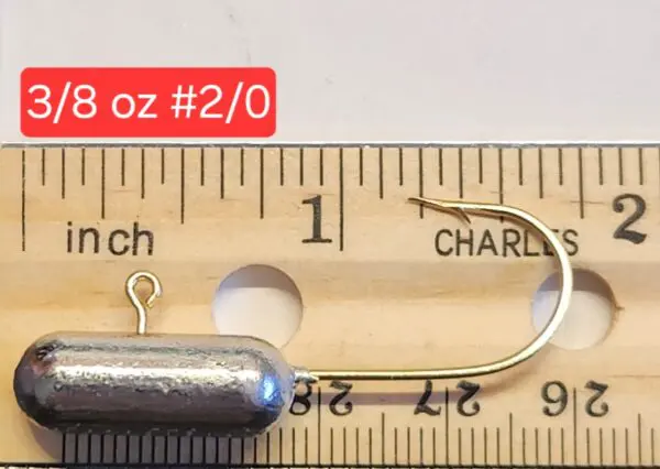 A fishing hook is shown on the ruler.