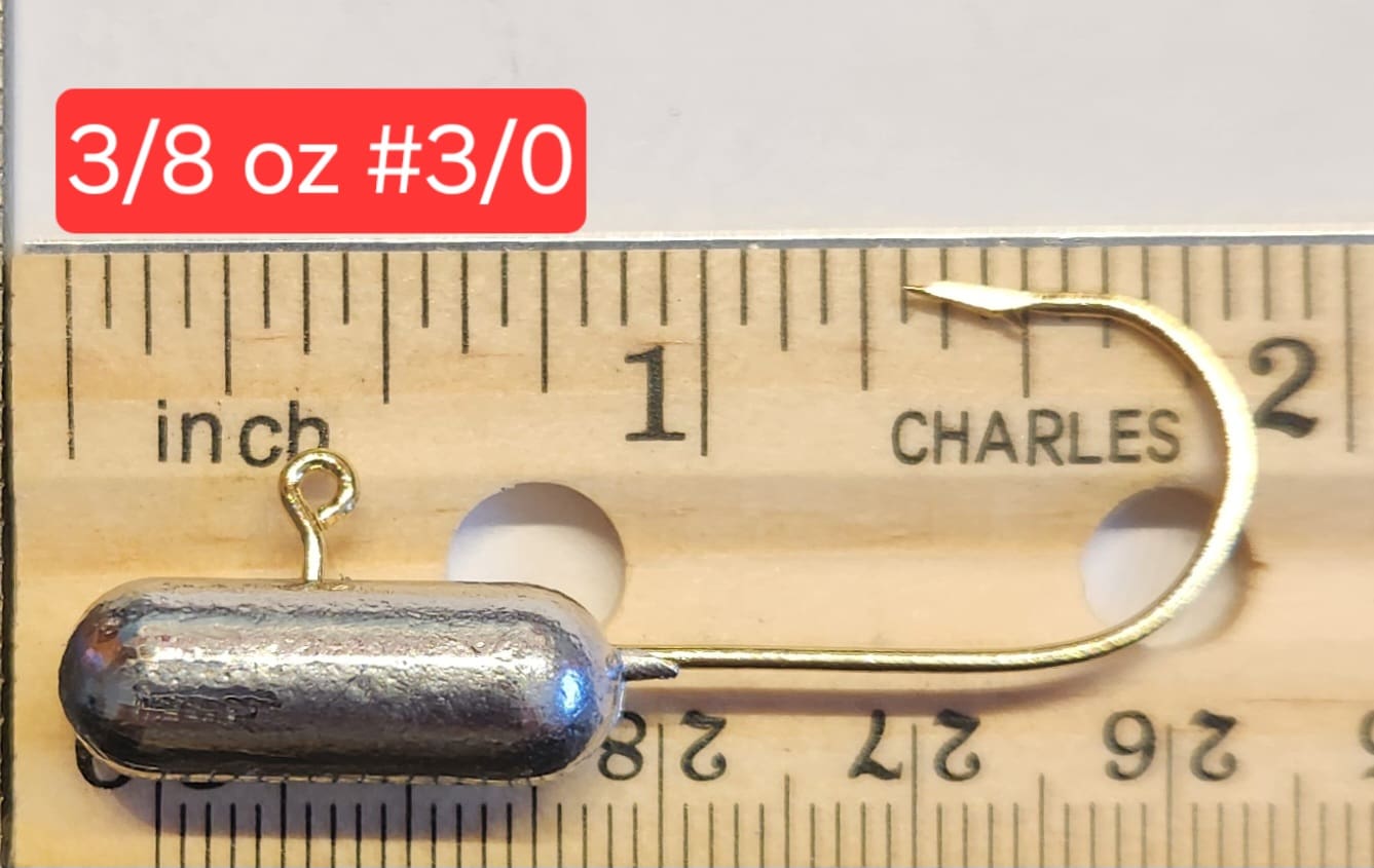 A metal object is shown on top of a ruler.