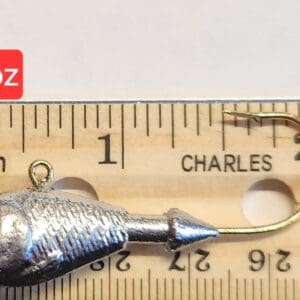 A fishing hook is shown next to a ruler.